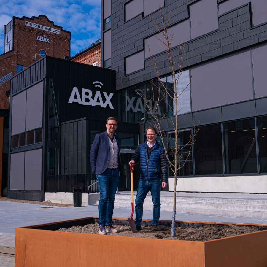 Atle Bruce Karlsen and Morten Strand planting trees outside corbon neutral office in Larvik, Norway 