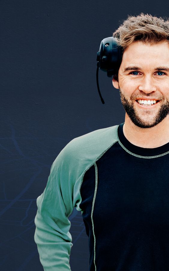  Smily worker with headset in front of ABAX logo