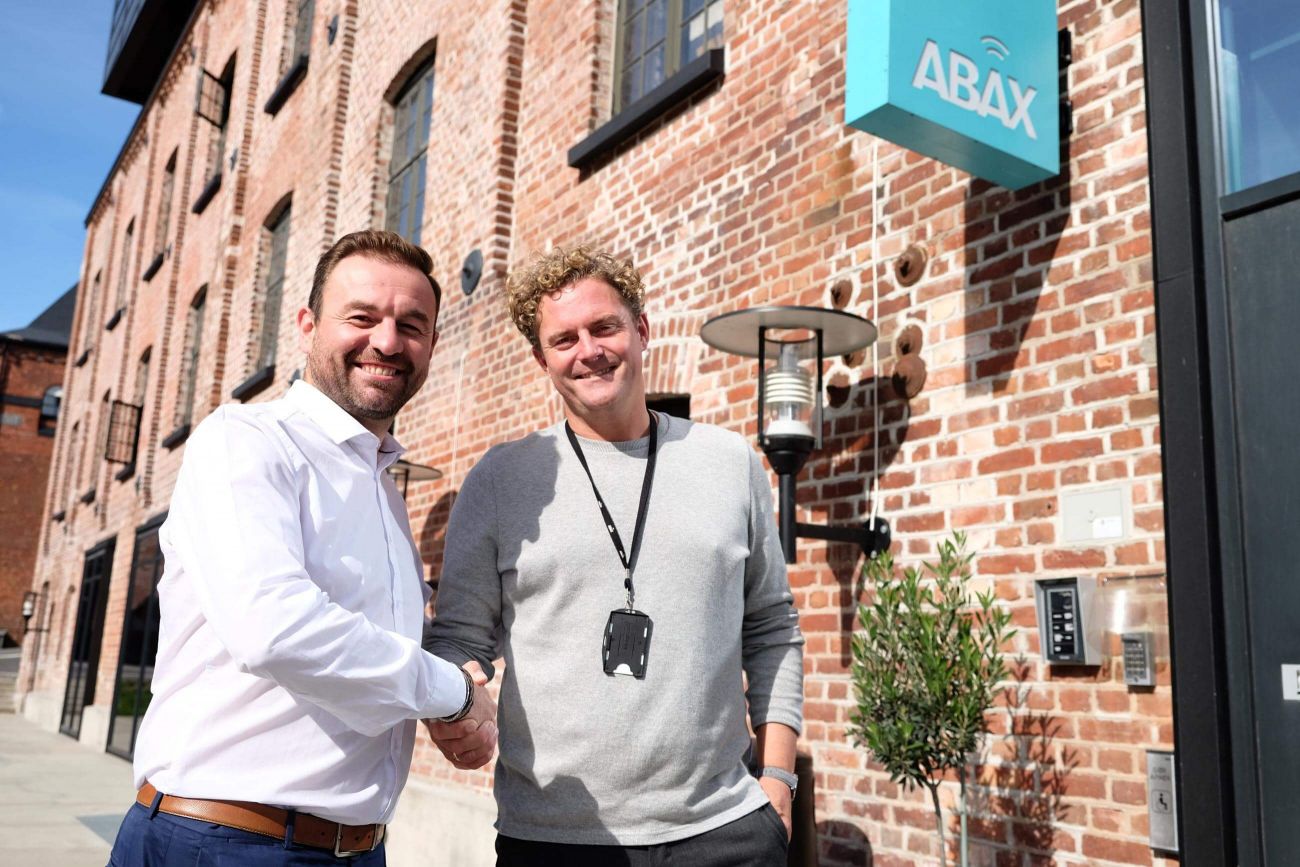 CTO Paul Walsh and COO Bjørn Erik Helgeland standing outside the ABAX headquarters in Larvik